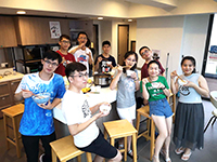 Participants enjoy hotpot at the hostel